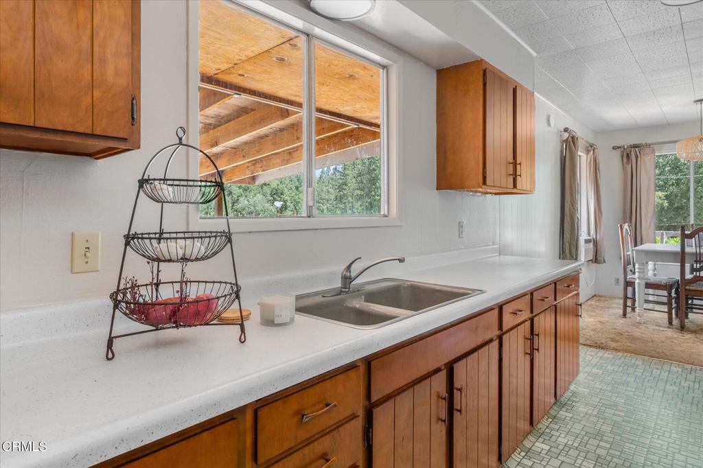 2660 Independence Road Mokelumne Hill, CA 95245 - Photo 11 of 37 a kitchen with a sink and cabinets
