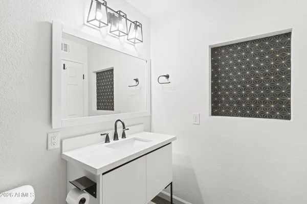 an empty room with closet area
