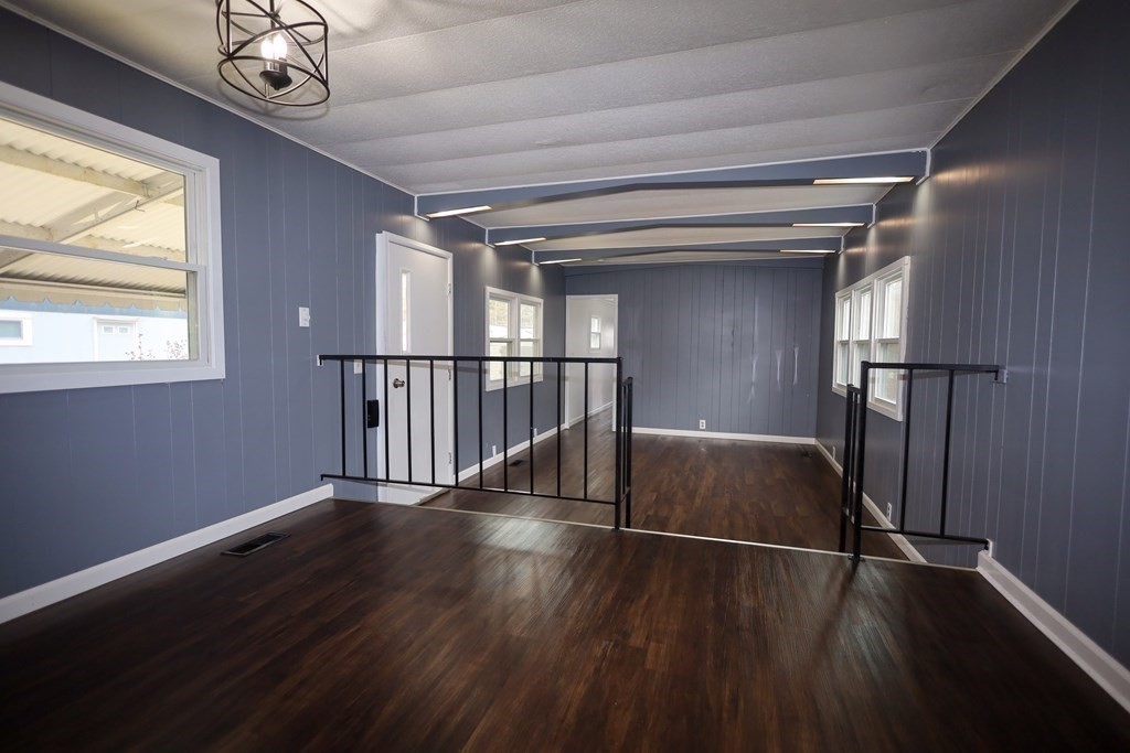 26 Claudia Street Wareham, MA 02538 - Photo 4 of 17 a view of an empty room with wooden floor and a window