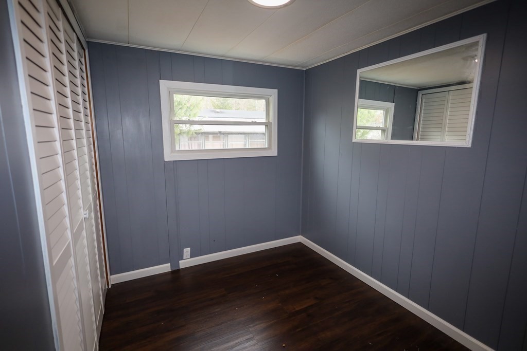 26 Claudia Street Wareham, MA 02538 - Photo 7 of 17 a view of an empty room with wooden floor and a window