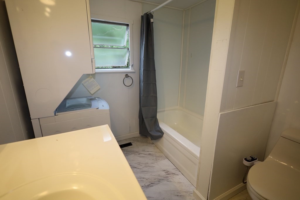 26 Claudia Street Wareham, MA 02538 - Photo 9 of 17 a bathroom with a tub and toilet