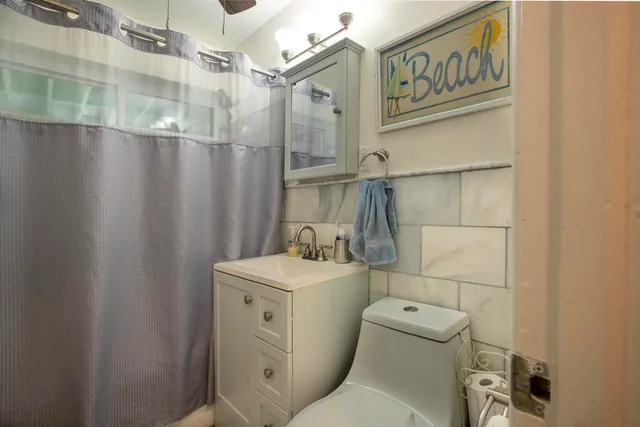 a bathroom with a toilet and a sink