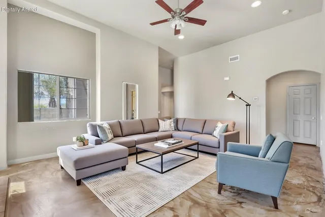 a living room with furniture and a large window