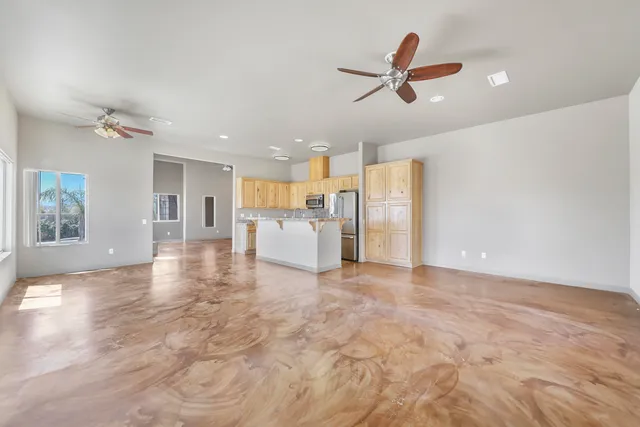 a view of a kitchen with a sink and a refrigerator