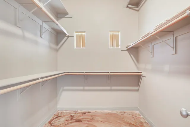 a view of an empty walk in closet