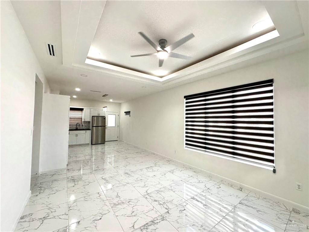 2300 East San Andrea Street, Unit 2 Edinburg, TX 78542 - Photo 2 of 12 a view of a livingroom with a kitchen
