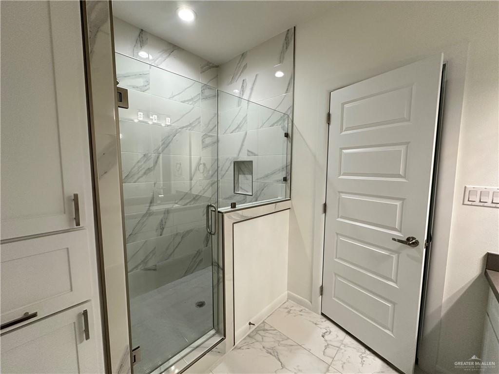 2300 East San Andrea Street, Unit 2 Edinburg, TX 78542 - Photo 9 of 12 a bathroom with a shower and closet