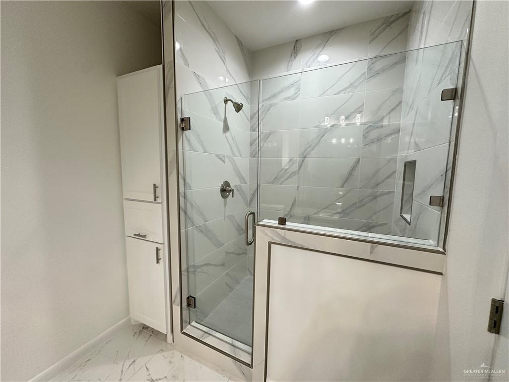 2300 East San Andrea Street, Unit 2 Edinburg, TX 78542 - Photo 10 of 12 a bathroom with a glass shower door