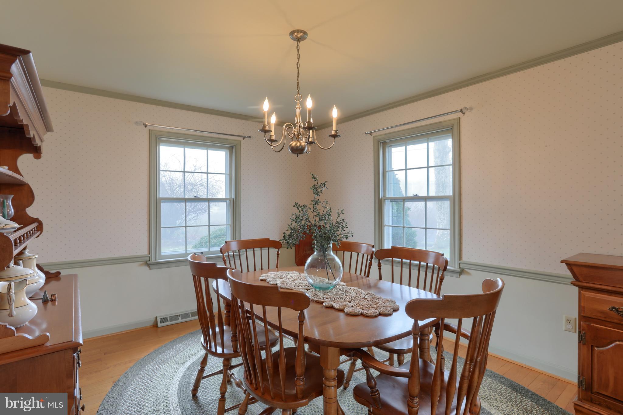 17 Becker Drive Lititz, PA 17543 - Photo 8 of 50 formal dining with hardwood, chair rail, and crown