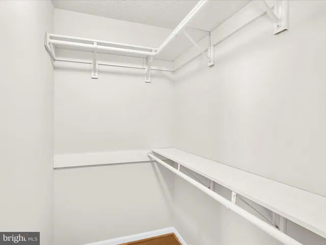 a view of an empty walk in closet