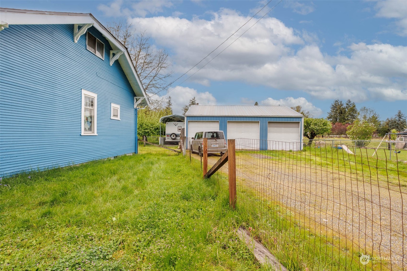533 McNaught Road South Roy, WA 98580 - Photo 4 of 29 a view of a house with a swimming pool