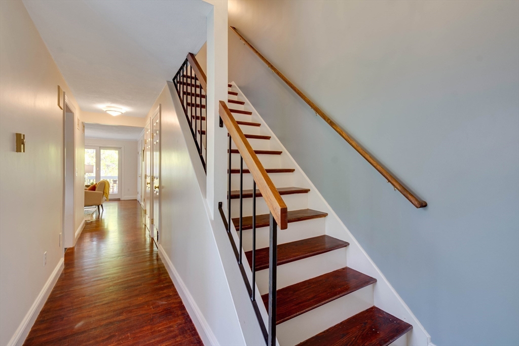 134 Chestnut Circle, Unit 134 Lincoln, MA 01773 - Photo 15 of 38 a view of entryway and hall with wooden floor