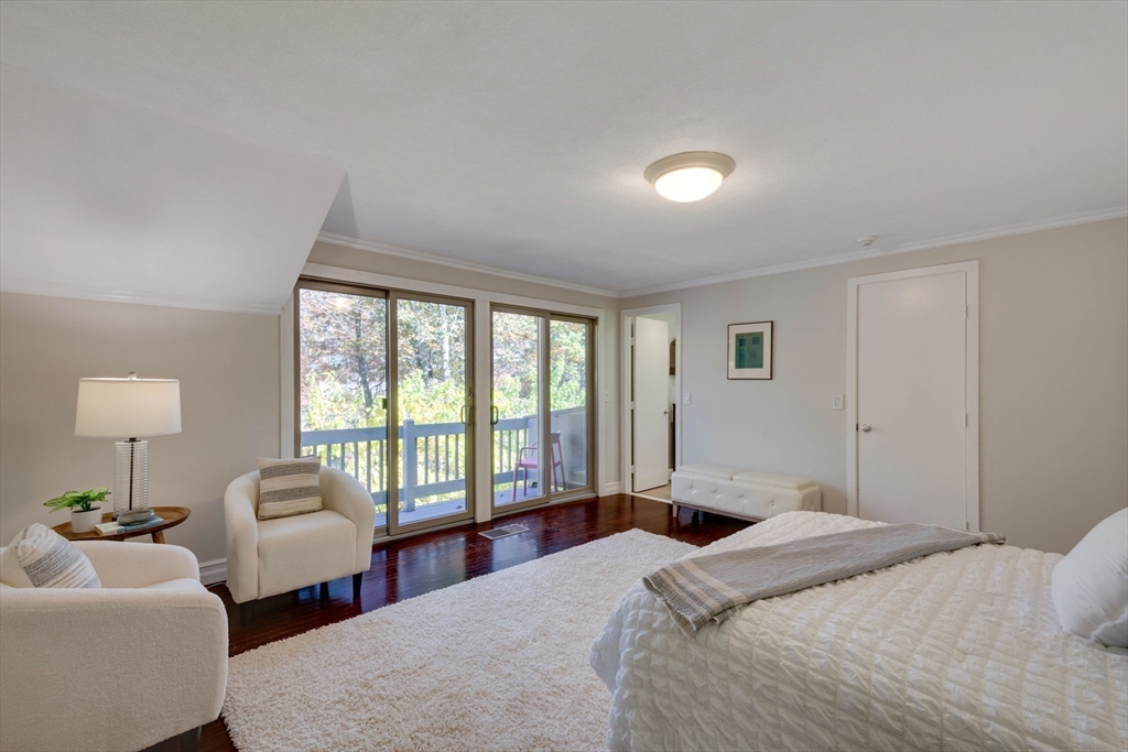 134 Chestnut Circle, Unit 134 Lincoln, MA 01773 - Photo 18 of 38 a bedroom with two beds and a large window