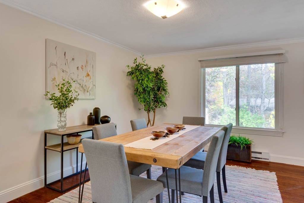 134 Chestnut Circle, Unit 134 Lincoln, MA 01773 - Photo 3 of 38 a view of a dining room with furniture window and wooden floor