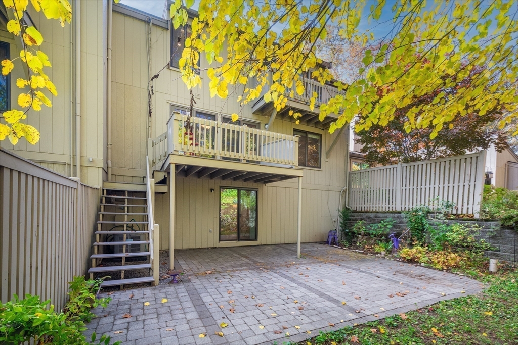 134 Chestnut Circle, Unit 134 Lincoln, MA 01773 - Photo 31 of 38 a front view of a house with plants and trees