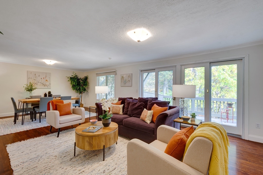 134 Chestnut Circle, Unit 134 Lincoln, MA 01773 - Photo 6 of 38 a living room with furniture and a large window