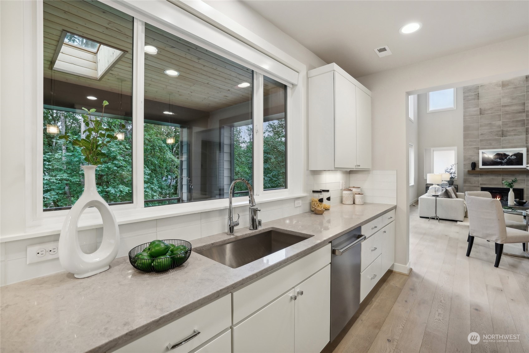 9933 Northeast 162nd Street Bothell, WA 98011 - Photo 13 of 40 a kitchen with a sink and a large window