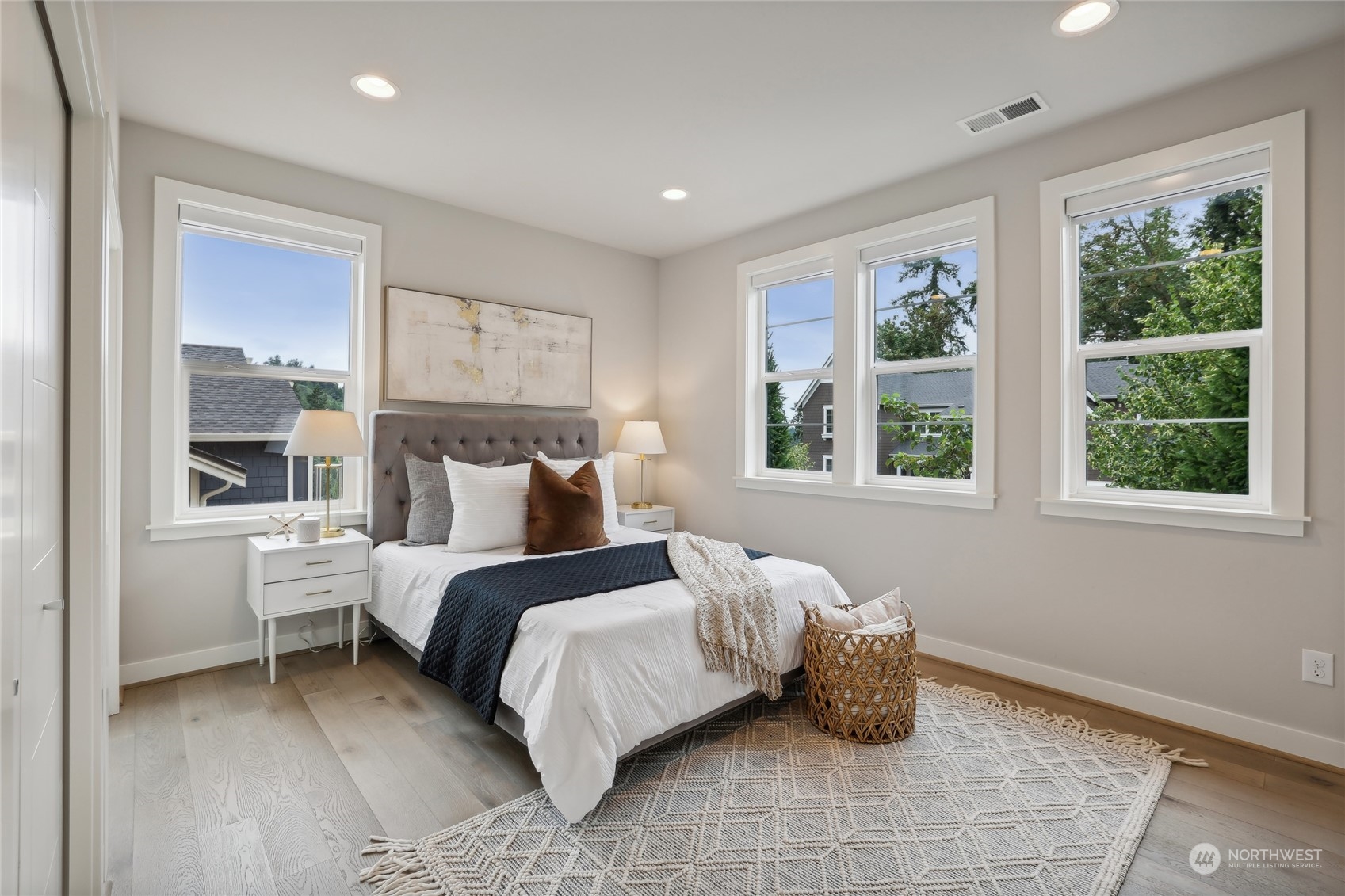 9933 Northeast 162nd Street Bothell, WA 98011 - Photo 16 of 40 a bedroom with a bed and a window