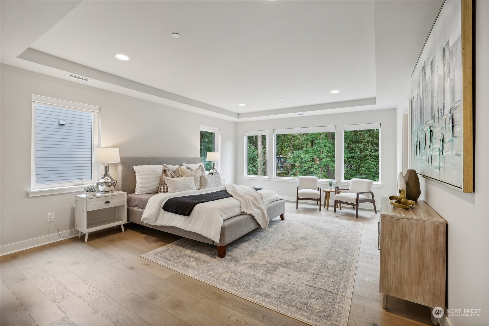 9933 Northeast 162nd Street Bothell, WA 98011 - Photo 20 of 40 a bedroom with furniture and large windows