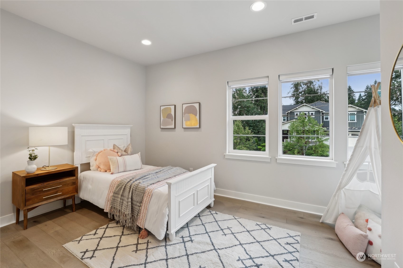 9933 Northeast 162nd Street Bothell, WA 98011 - Photo 24 of 40 a bedroom with a bed and a window