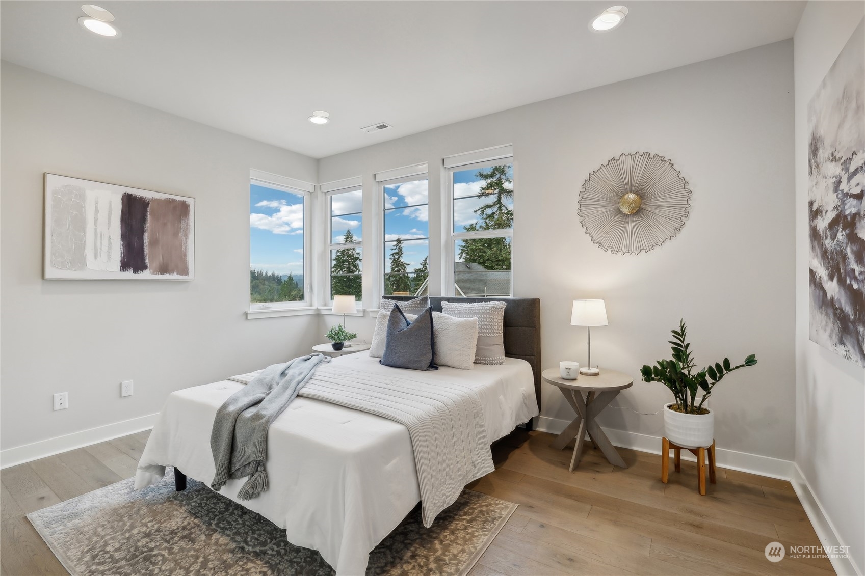 9933 Northeast 162nd Street Bothell, WA 98011 - Photo 25 of 40 a bedroom with a bed and painting on the wall