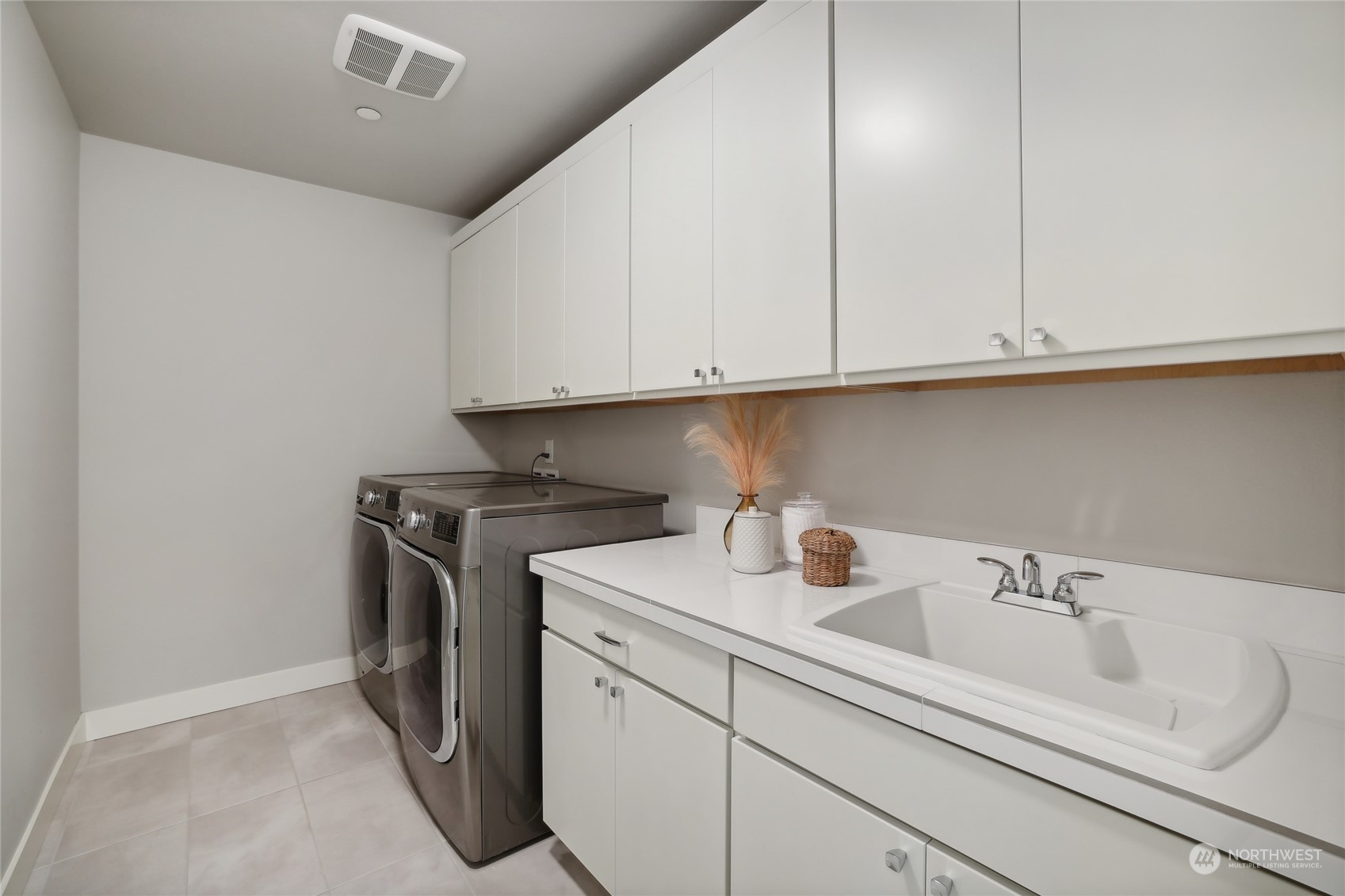 9933 Northeast 162nd Street Bothell, WA 98011 - Photo 27 of 40 a view of a sink with washer and dryer