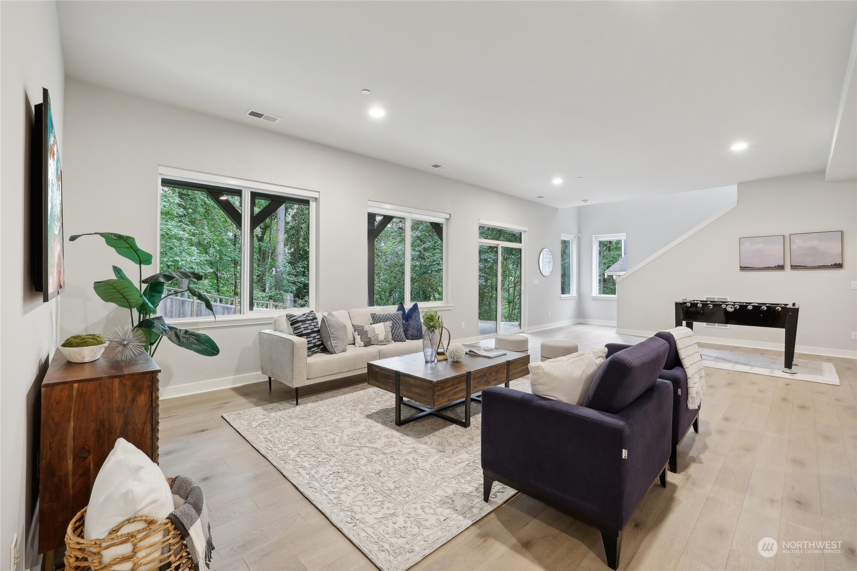 9933 Northeast 162nd Street Bothell, WA 98011 - Photo 28 of 40 a living room with furniture and large windows