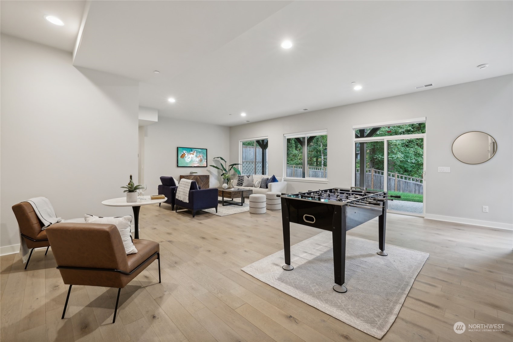 9933 Northeast 162nd Street Bothell, WA 98011 - Photo 30 of 40 a living room with furniture a rug and a large window
