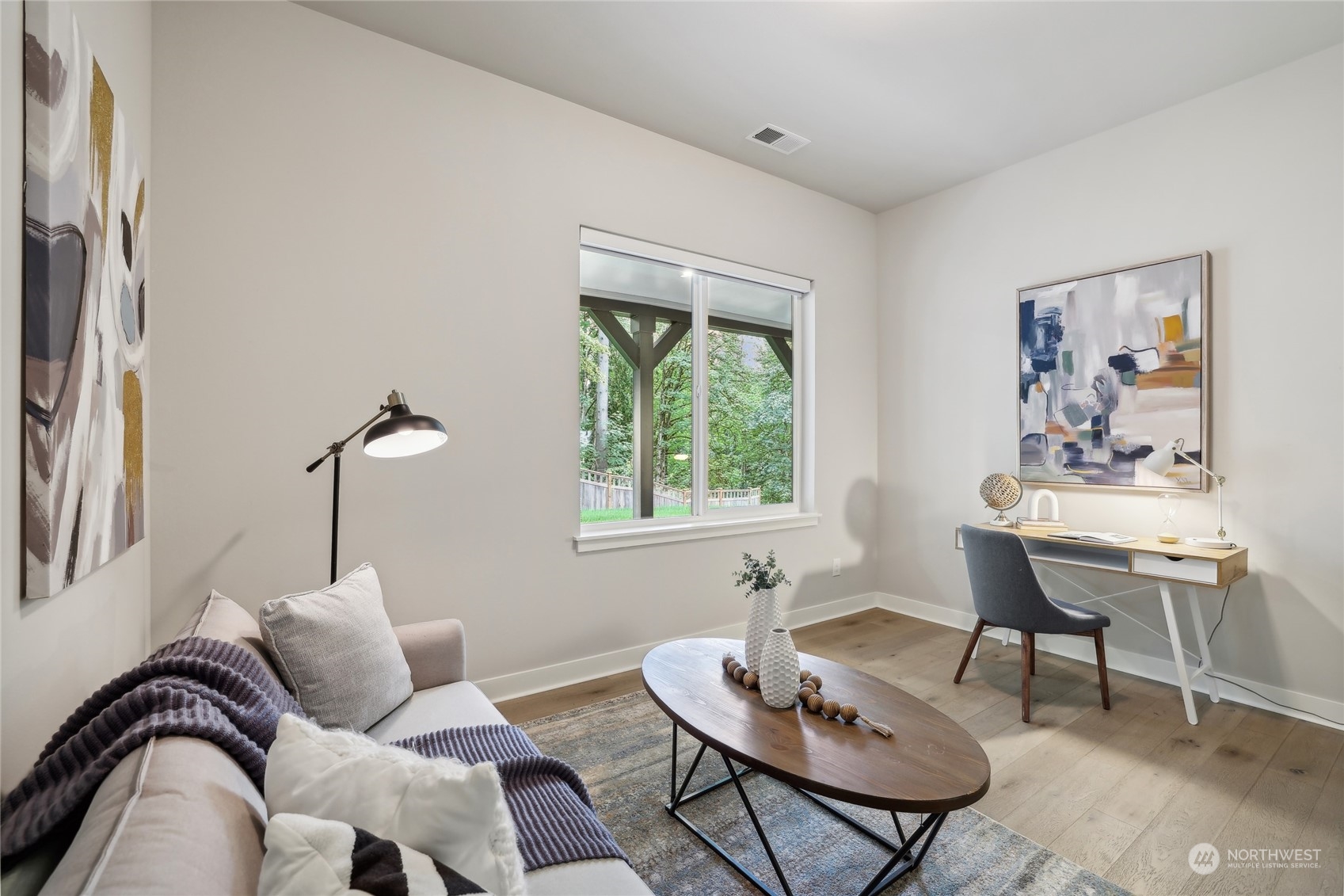 9933 Northeast 162nd Street Bothell, WA 98011 - Photo 34 of 40 a living room with furniture and a window
