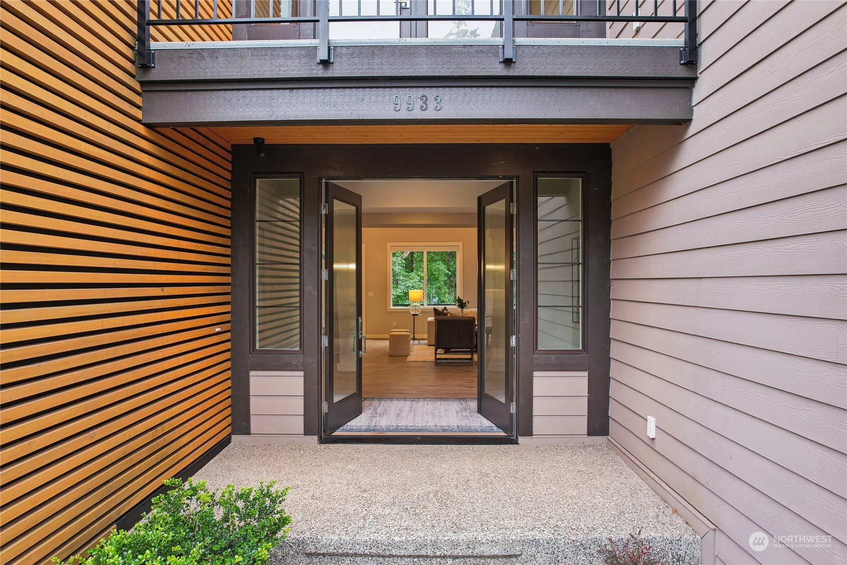 9933 Northeast 162nd Street Bothell, WA 98011 - Photo 4 of 40 a view of a porch with a door and a wooden fence