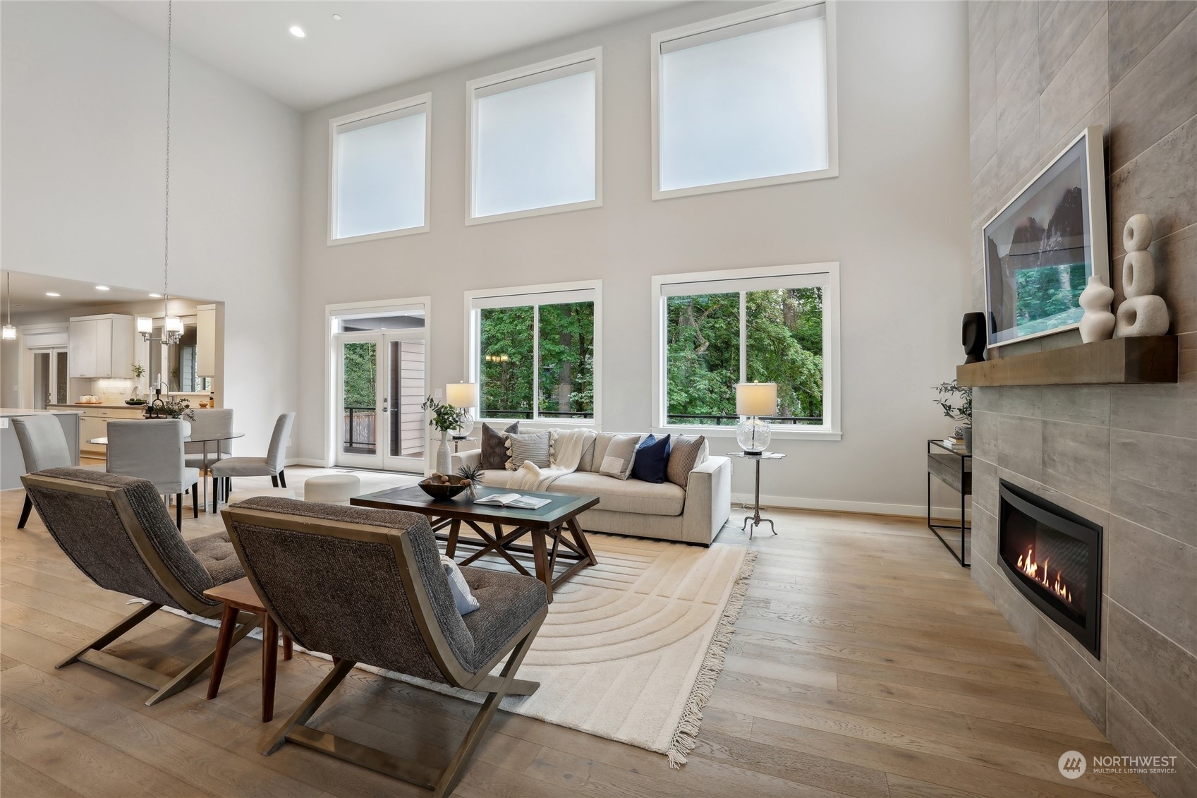9933 Northeast 162nd Street Bothell, WA 98011 - Photo 6 of 40 a living room with furniture two window and a fireplace