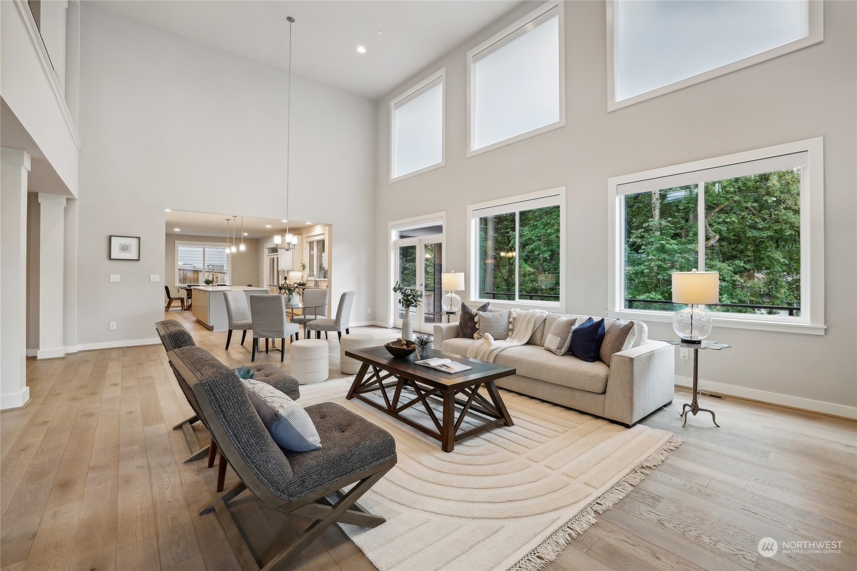 9933 Northeast 162nd Street Bothell, WA 98011 - Photo 9 of 40 a living room with furniture and floor to ceiling windows