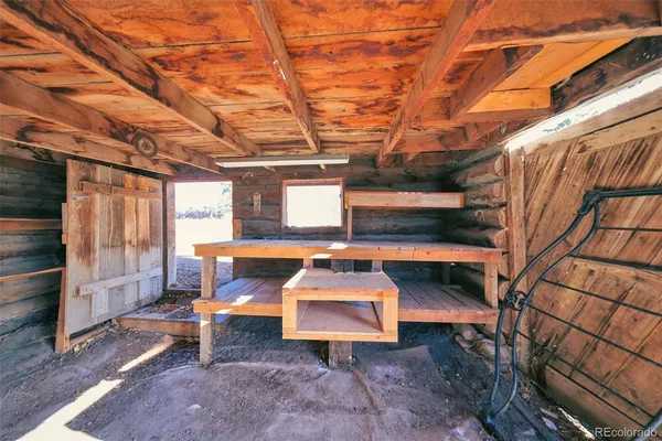 a view of a room with wooden walls