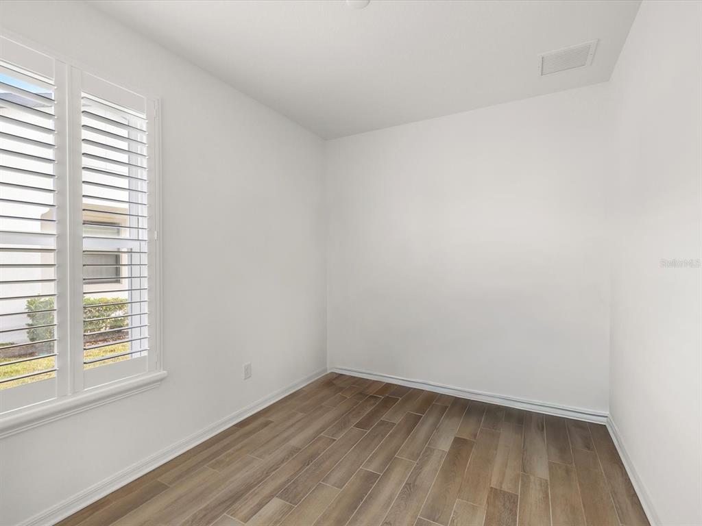 5219 Cappleman Loop Brooksville, FL 34601 - Photo 27 of 60 an empty room with a window