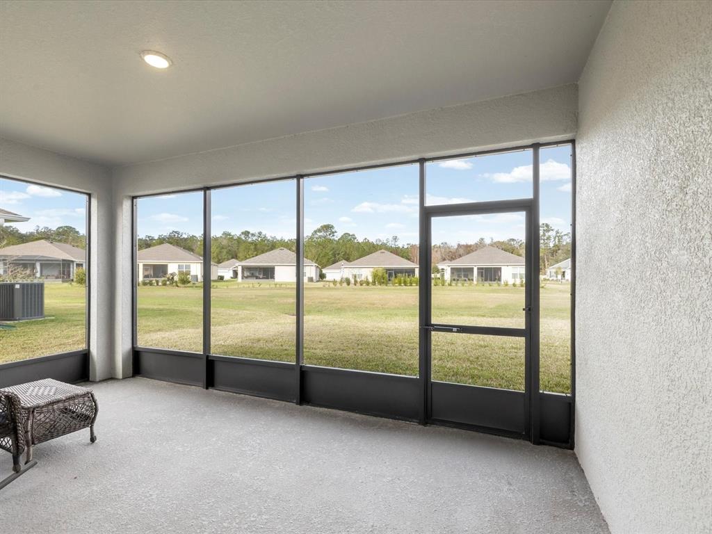 5219 Cappleman Loop Brooksville, FL 34601 - Photo 32 of 60 a view of an empty room with large windows
