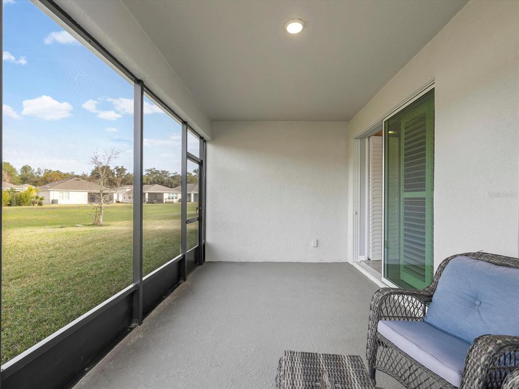 5219 Cappleman Loop Brooksville, FL 34601 - Photo 33 of 60 a view of balcony with couch