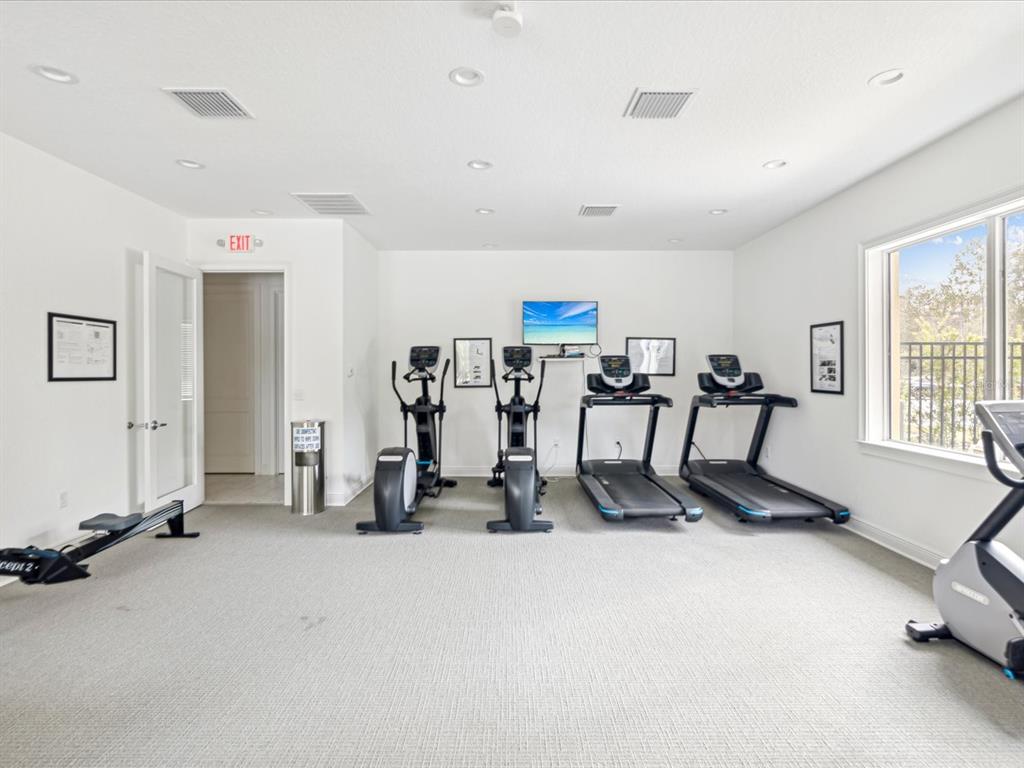 5219 Cappleman Loop Brooksville, FL 34601 - Photo 49 of 60 a view of a room with gym equipment