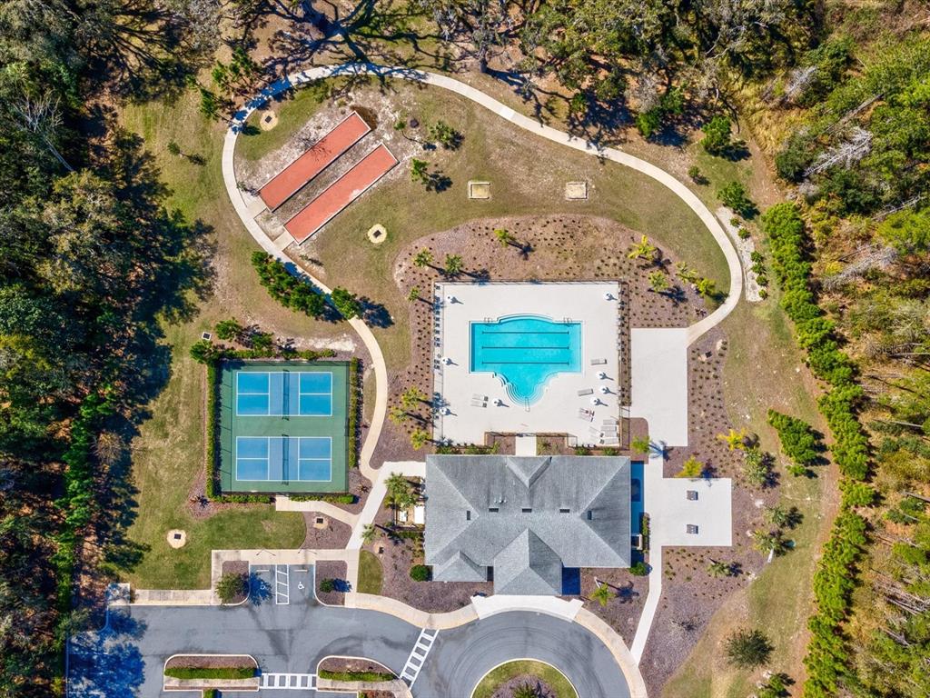 5219 Cappleman Loop Brooksville, FL 34601 - Photo 57 of 60 an aerial view of a house with swimming pool and outdoor seating