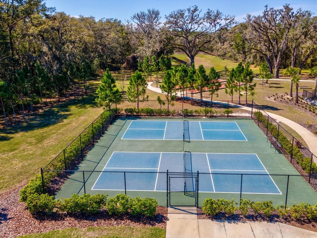5219 Cappleman Loop Brooksville, FL 34601 - Photo 59 of 60 a view of a swimming pool with a lounge chairs