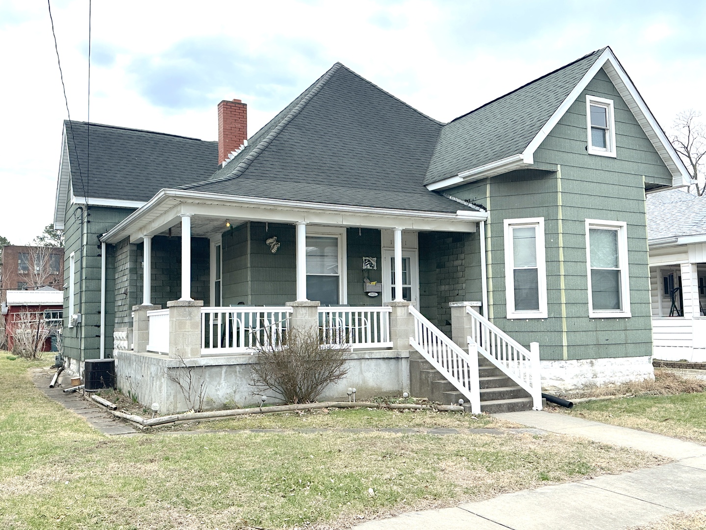 1821 Division Street Murphysboro, IL 62966 - Photo 1 of 16 a view of a house with a small yard and plants