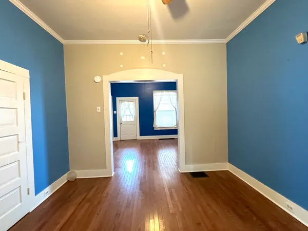 a view of hallway with wooden floor