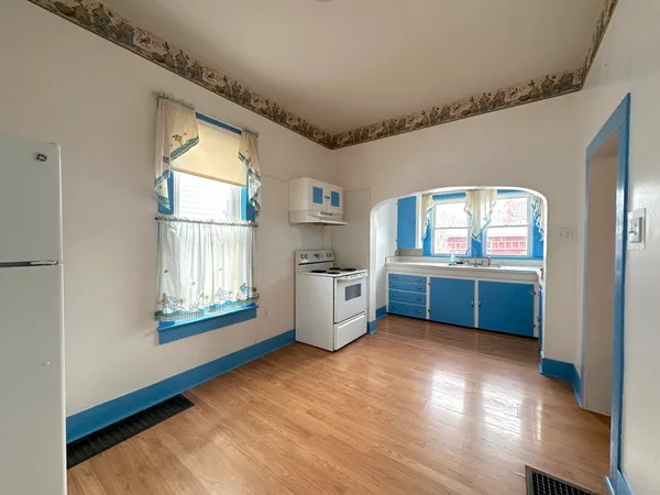 a view of kitchen with utility room and windows