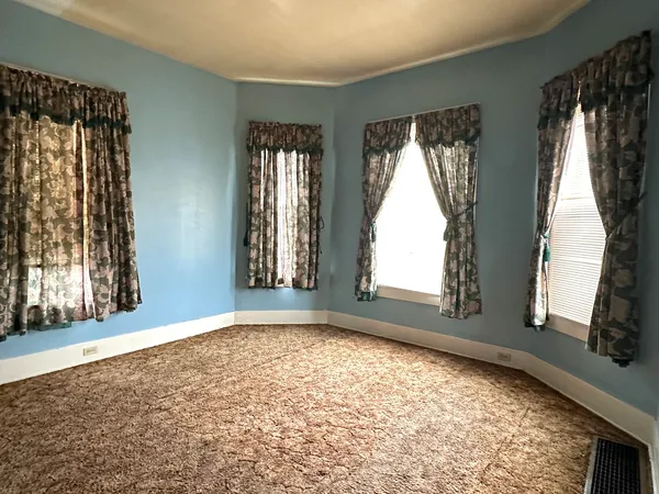 a view of an empty room and window