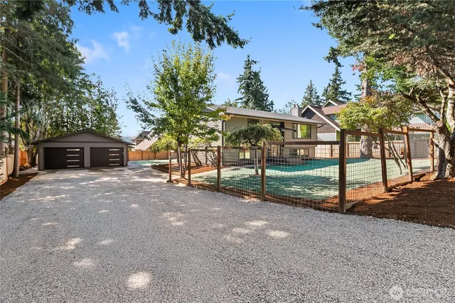 a view of house with outdoor space and trees