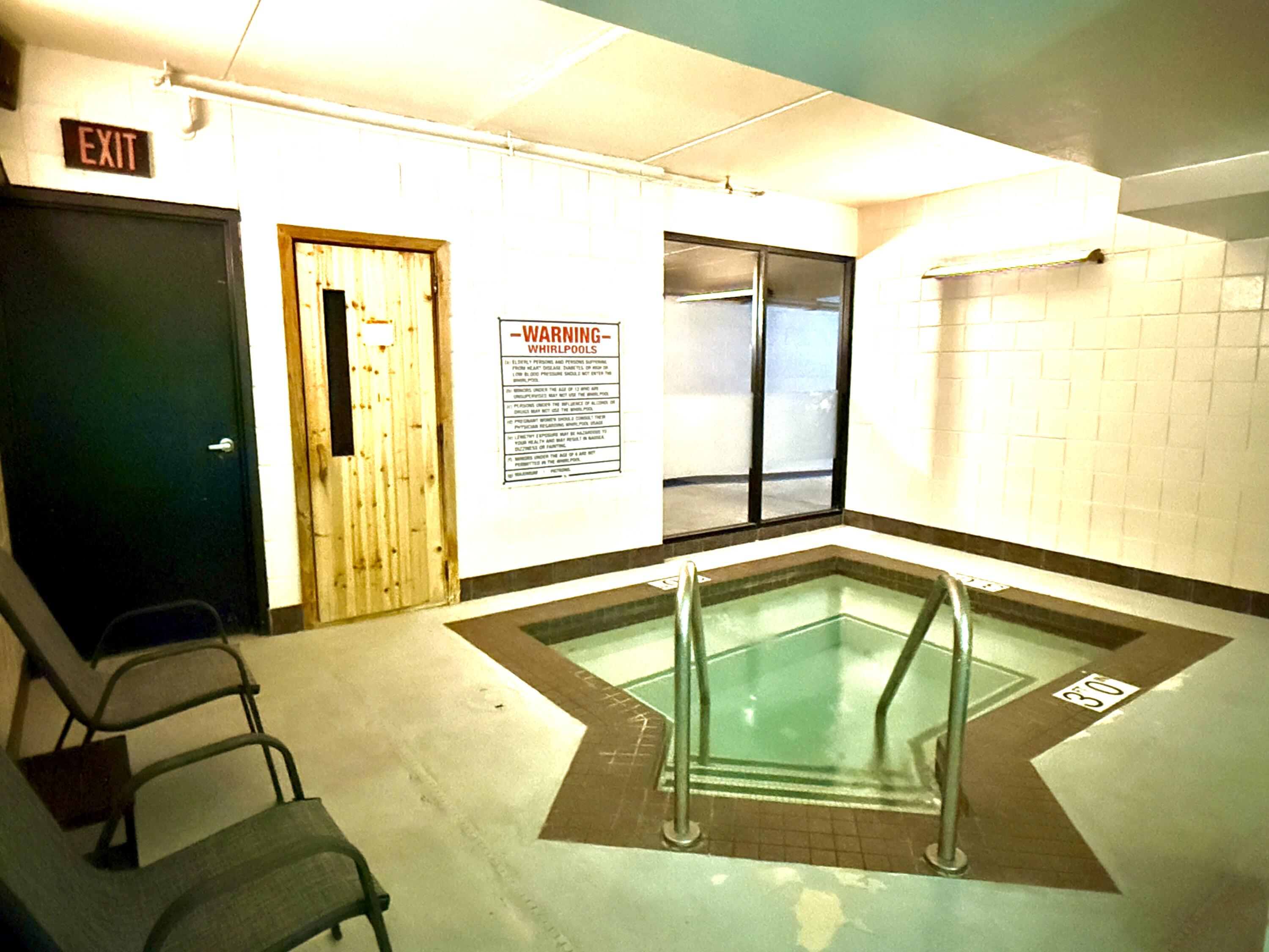 270 East Highland Avenue, Unit 446 Milwaukee, WI 53202 - Photo 24 of 29 Hot tub next to pool