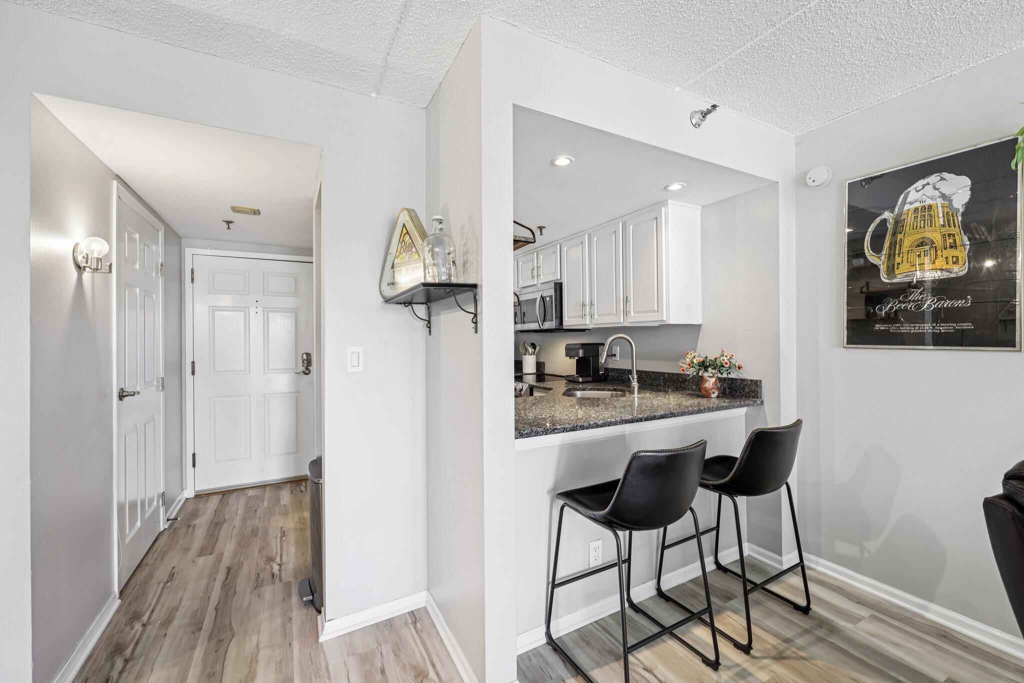 270 East Highland Avenue, Unit 446 Milwaukee, WI 53202 - Photo 9 of 29 Entry and breakfast bar