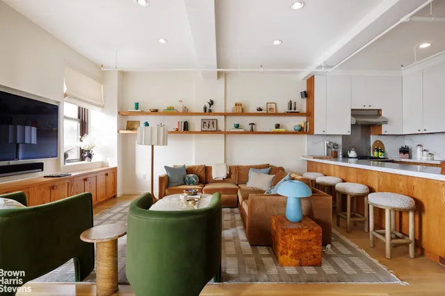 a kitchen with stainless steel appliances kitchen island granite countertop a sink and cabinets