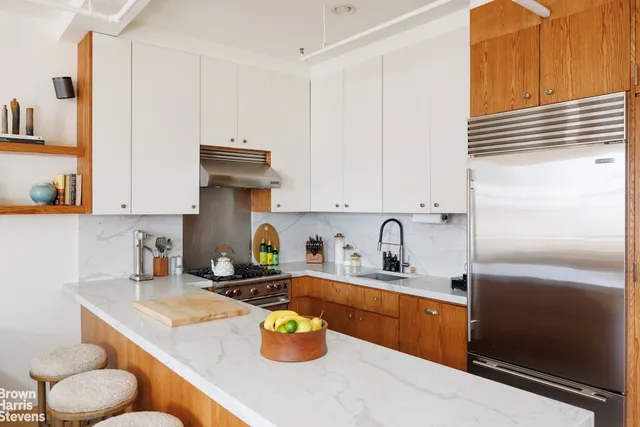 a kitchen with a stove a refrigerator and a stove