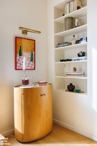 a kitchen with a sink a stove and wooden cabinets