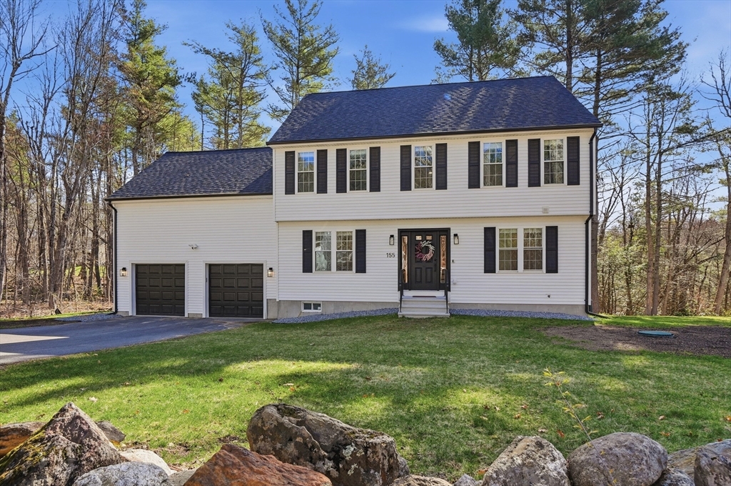 155 Turkey Hill Road Rutland, MA 01543 - Photo 1 of 38 a view of a yard in front of a house with plants and large tree
